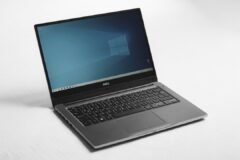 Laptop showing a blue Windows desktop, illustrating the Windows 11 26H2 update