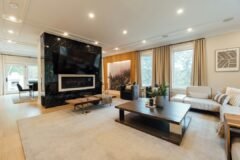 Modern living room with a connected smart home setup, illustrating the Apple HomeView smart display
